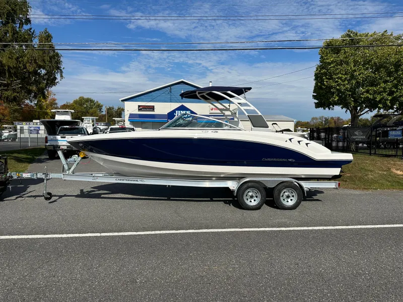 The Image of 2024 Chaparral 23 SSi boat on a trailer, parked outdoors. - 0