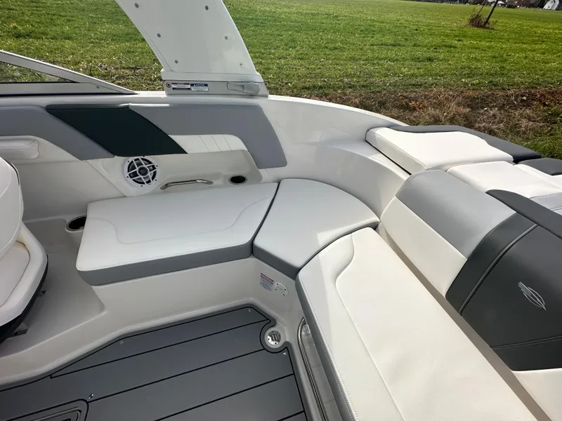 Slide: The Image of 2024 Chaparral 23 SSi boat interior with white and gray seating. - 28