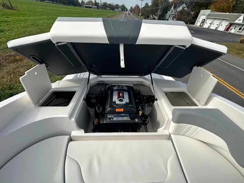 Slide: The Image of 2024 Chaparral 23 SSi boat with open engine compartment. - 35