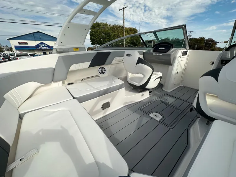 Slide: The Image of 2024 Chaparral 23 SSi boat interior with seating and helm station. - 39
