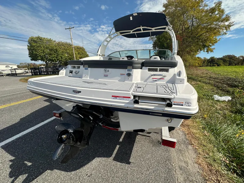 Slide: The Image of 2024 Chaparral 23 SSi boat, rear view on a sunny day. - 47