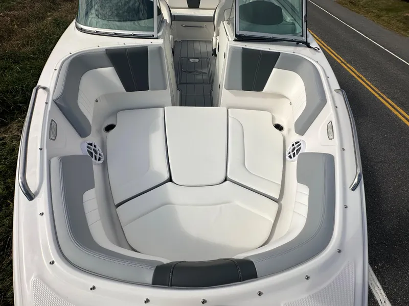 Slide: The Image of 2024 Chaparral 23 SSi boat interior with white and gray seating. - 5