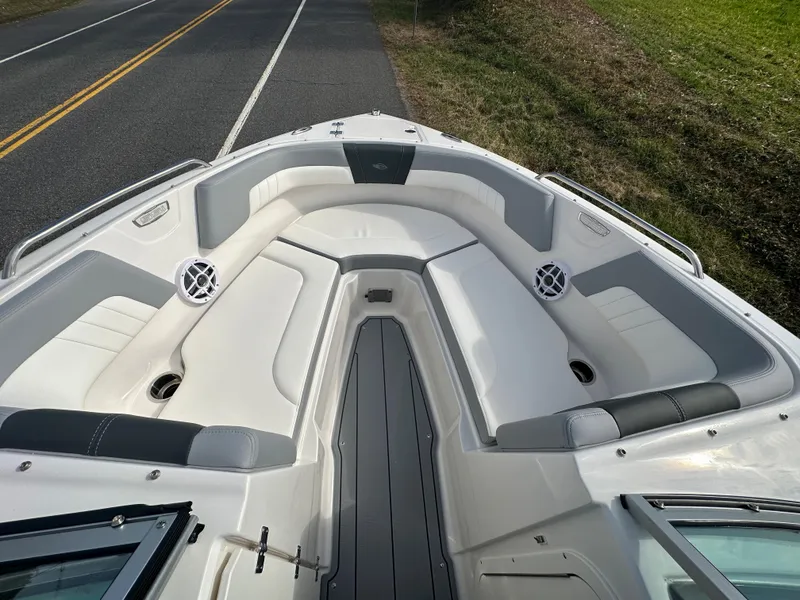 Slide: The Image of 2024 Chaparral 23 SSi boat interior with white and gray seating. - 6