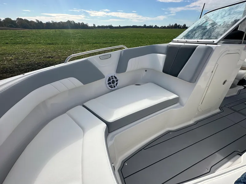 Slide: The Image of 2024 Chaparral 23 SSi boat interior with white and gray seating. - 7