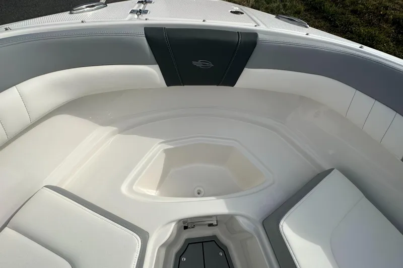 Slide: The Image of 2024 Chaparral 23 SSi boat interior with white and gray seating. - 9
