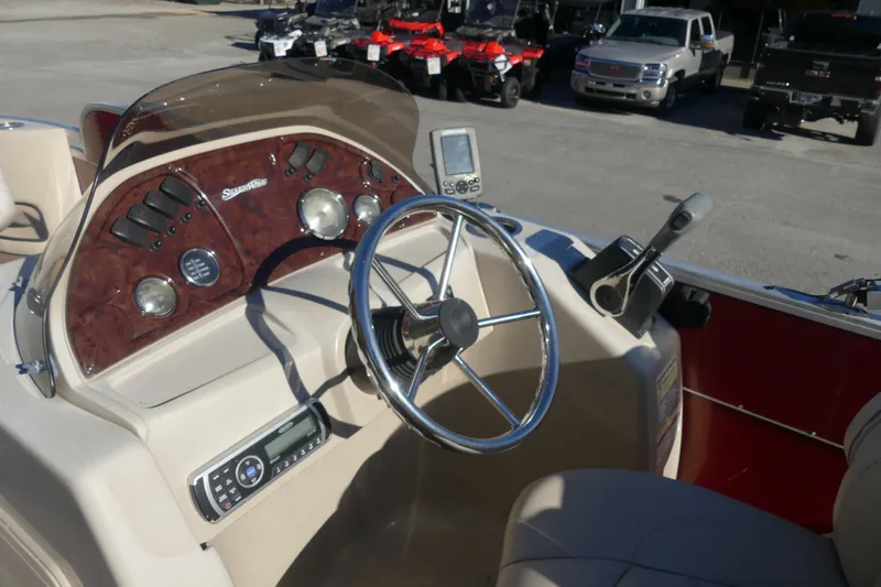 Slide: The Image of Steering console of 2015 Silver Wave 230 Island F boat with controls and gauges. - 5