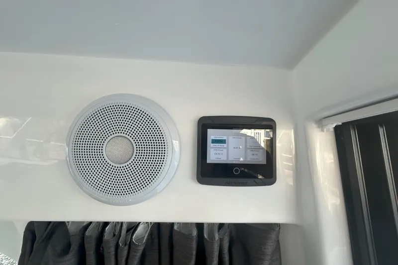 Slide: The Image of 2024 Beneteau Antares 9 interior with speaker and control panel. - 15