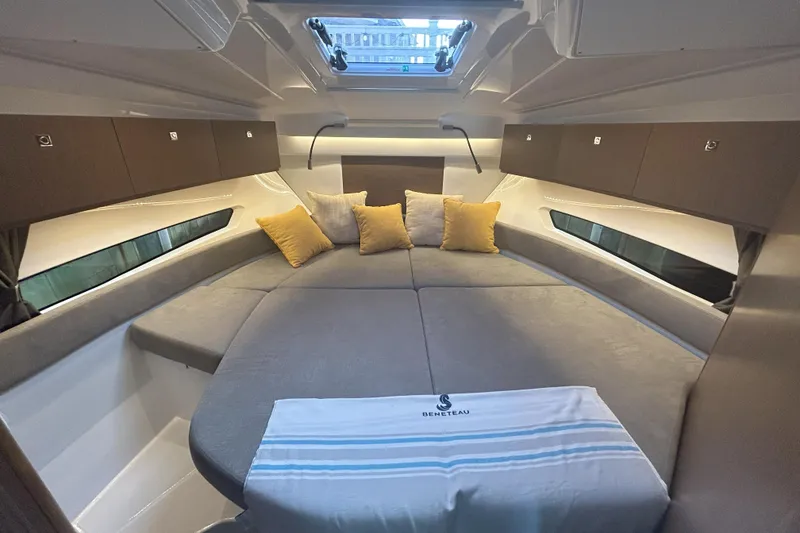 Slide: The Image of 2024 Beneteau Antares 9 cabin interior with cozy bedding and modern design. - 16