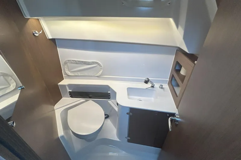 Slide: The Image of 2024 Beneteau Antares 9 bathroom interior with modern fixtures and compact design. - 18