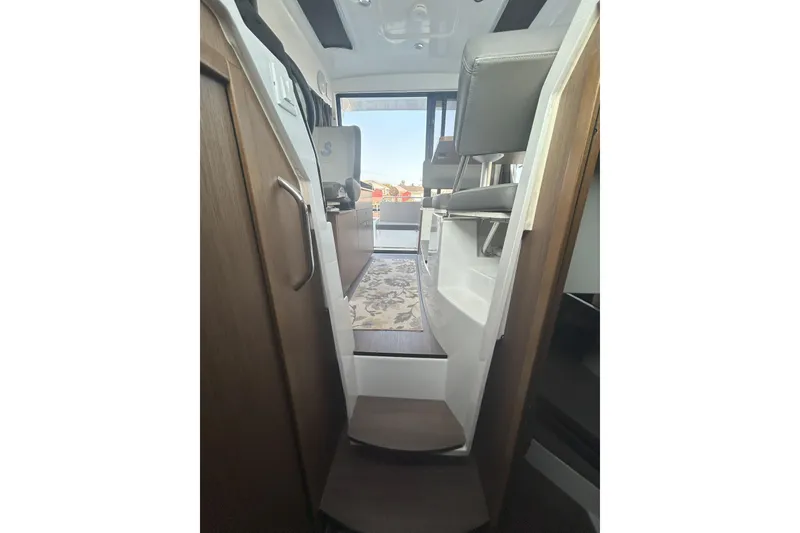 Slide: The Image of 2024 Beneteau Antares 9 interior with modern seating and sleek design. - 20