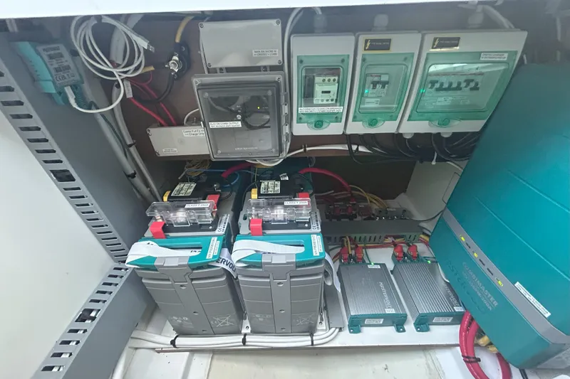 Slide: The Image of Electrical system of 2024 Beneteau Antares 9, featuring batteries and control panels. - 24