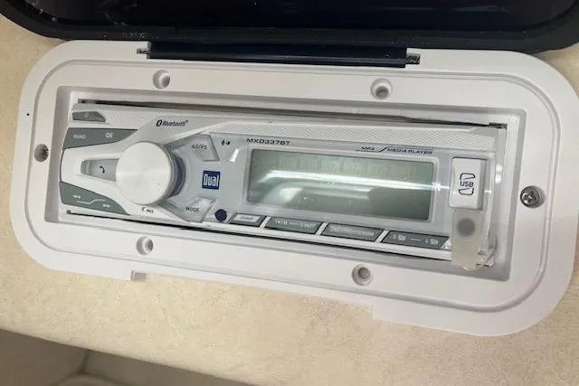 Slide: The Image of Boat stereo system in a 2001 Sea Ray 225 Weekender, featuring Bluetooth and USB connectivity. - 12