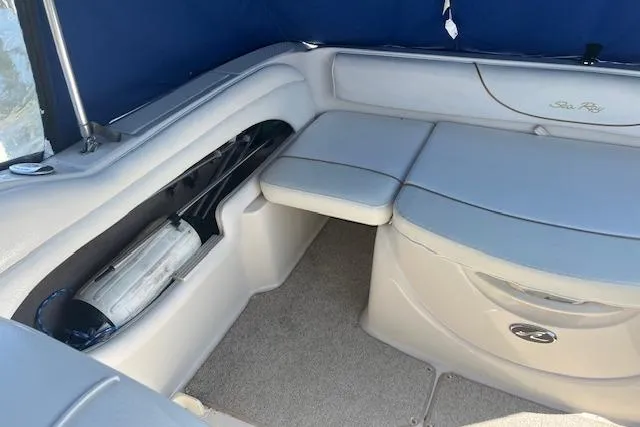 Slide: The Image of Interior seating of a 2001 Sea Ray 225 Weekender boat with blue upholstery. - 6