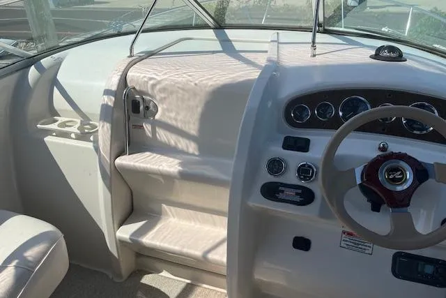 Slide: The Image of Interior view of 2001 Sea Ray 225 Weekender boat dashboard and steering wheel. - 9
