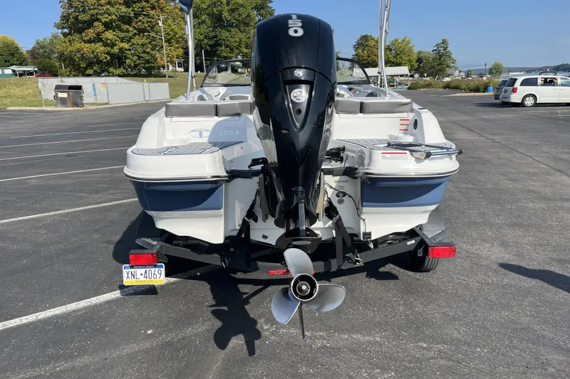 Slide: The Image of 2022 Tahoe 200 S boat with outboard motor in parking lot. - 5