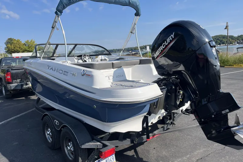 Slide: The Image of 2022 Tahoe 200 S boat with Mercury engine on trailer in parking lot. - 6