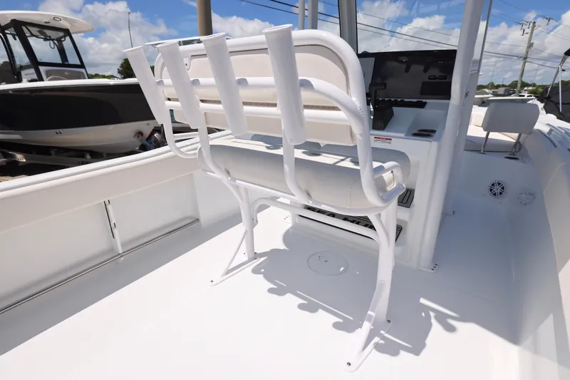 Slide: The Image of 2026 Sea Hunt Ultra 235 SE boat with Yamaha outboard motor, displayed outdoors. - 10