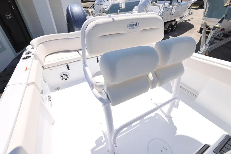 Slide: The Image of Interior view of 2026 Sea Hunt Ultra 235 SE boat, featuring seating and storage. - 11