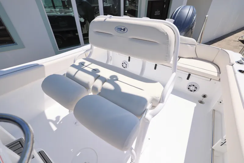 Slide: The Image of 2026 Sea Hunt Ultra 235 SE boat interior with white seating and modern design. - 3