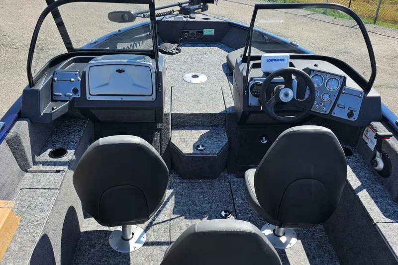 Slide: The Image of 2026 Bass Tracker PGV 175 boat interior with seating and trolling motor. - 14