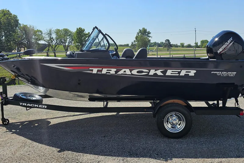 Slide: The Image of 2026 Bass Tracker PGV 175 boat on trailer, featuring sleek design and Mercury engine. - 2