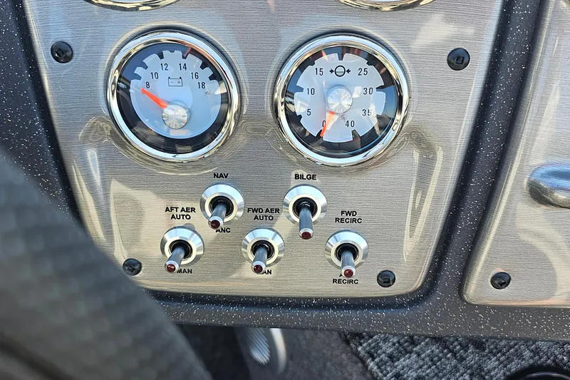 Slide: The Image of Dashboard controls of 2026 Bass Tracker PGV 175 boat with gauges and switches. - 21