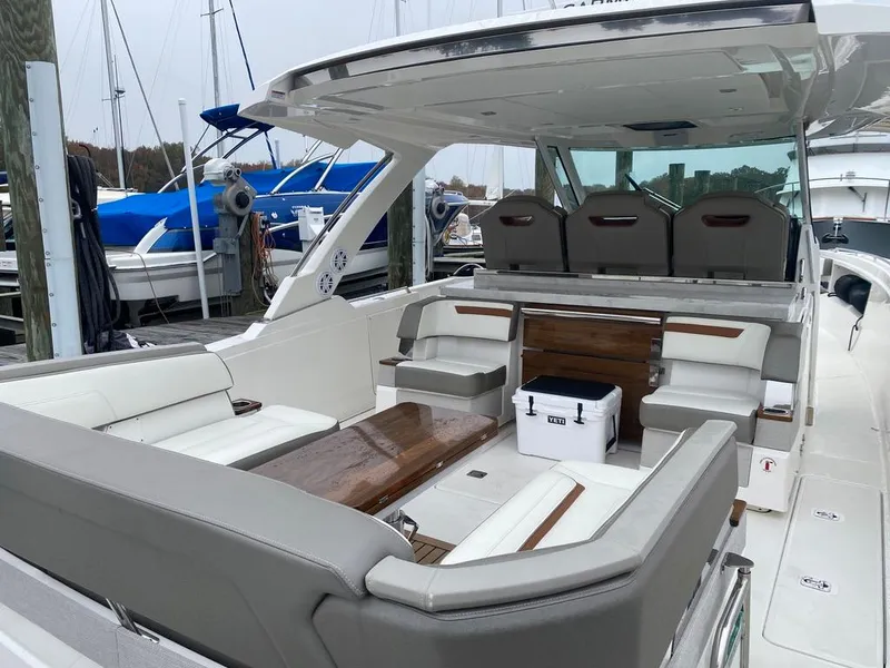 Slide: The Image of 2022 Tiara Yachts 38 LS luxury boat interior with seating and table. - 12