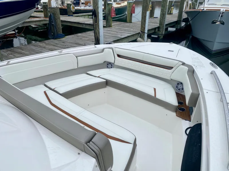 Slide: The Image of Luxurious seating area on 2022 Tiara Yachts 38 LS at marina dock. - 17