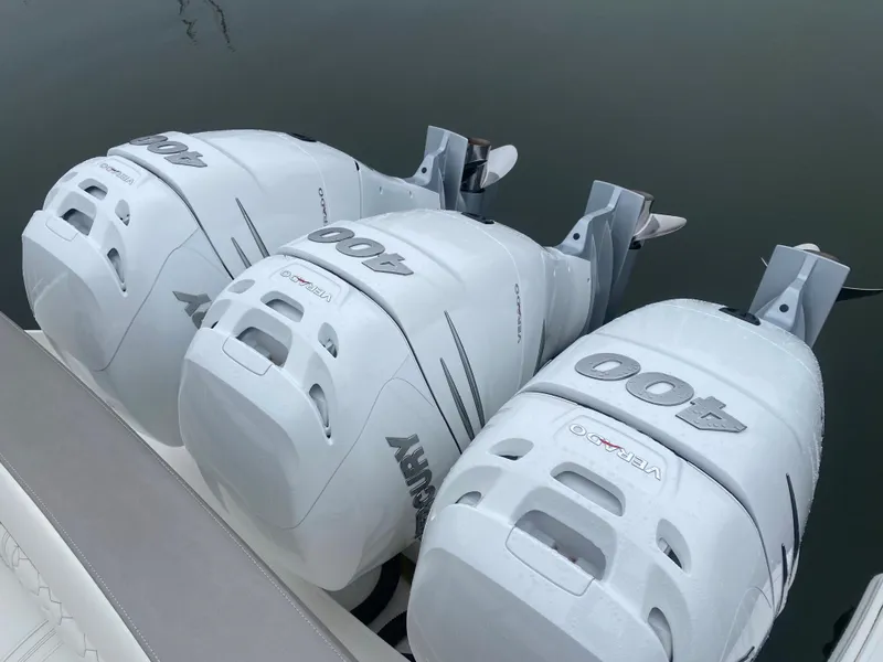 Slide: The Image of Luxurious cabin interior of 2022 Tiara Yachts 38 LS with cozy bedding and wooden accents. - 19