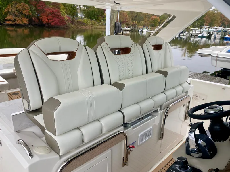 Slide: The Image of 2022 Tiara Yachts 38 LS luxury seating with elegant design and waterfront view. - 8