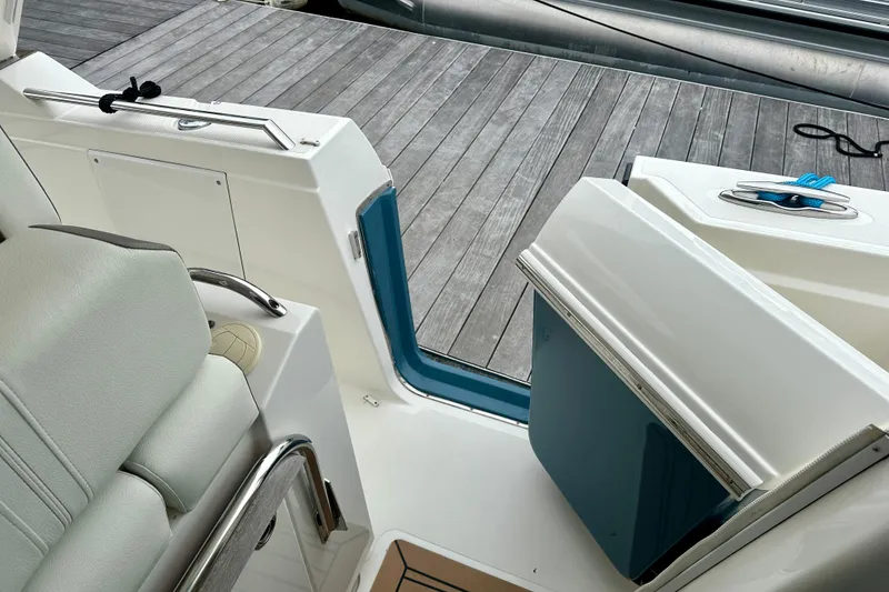 Slide: The Image of 2022 Tiara Yachts 38 LS interior with open door and dock view. - 9