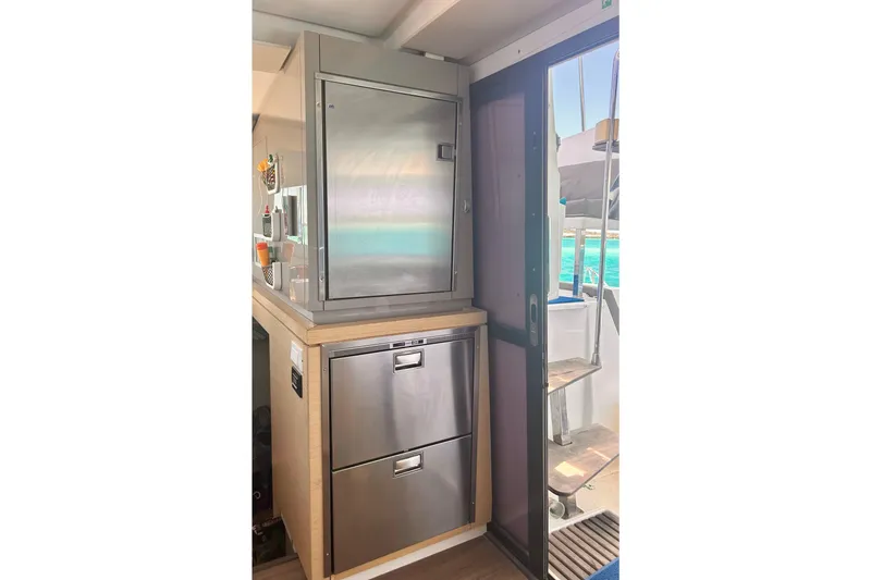 Slide: The Image of Modern kitchen area on 2018 Fountaine Pajot Lucia 40 catamaran with stainless steel appliances. - 15