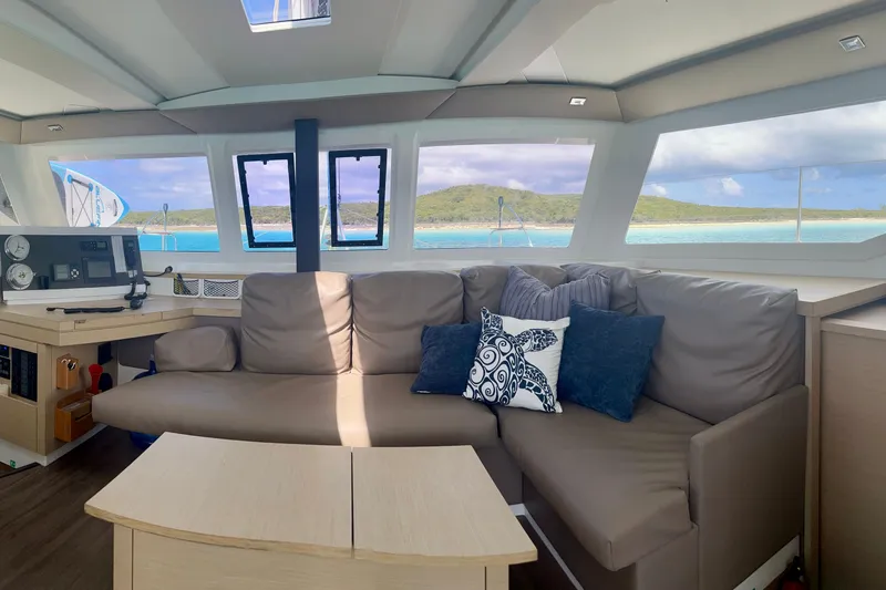 Slide: The Image of Interior of 2018 Fountaine Pajot Lucia 40 catamaran with ocean view through large windows. - 19