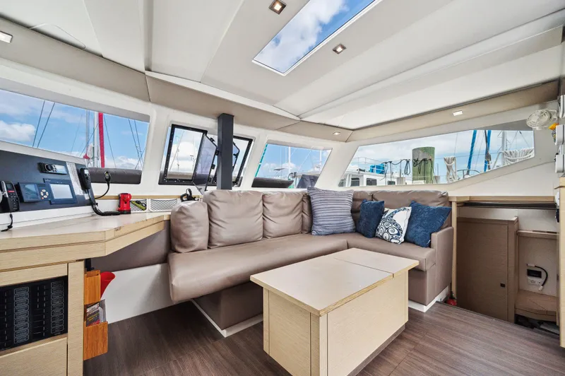 Slide: The Image of Interior of 2018 Fountaine Pajot Lucia 40 catamaran with modern seating and navigation area. - 22