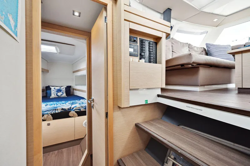 Slide: The Image of Interior of 2018 Fountaine Pajot Lucia 40 catamaran, featuring cozy cabin and modern living area. - 35