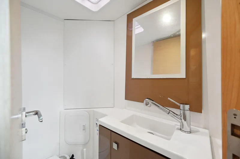 Slide: The Image of Bathroom interior of 2018 Fountaine Pajot Lucia 40 catamaran, featuring modern sink and mirror. - 42