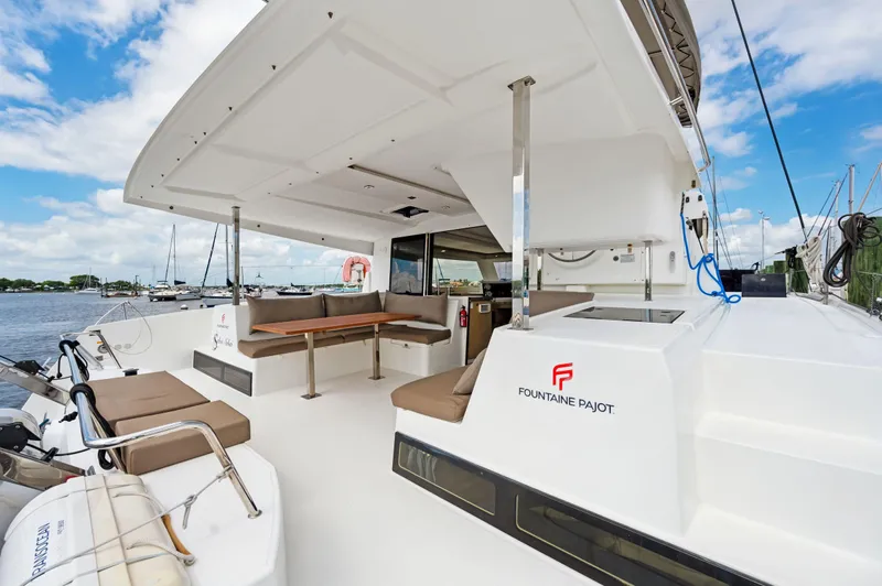 Slide: The Image of 2018 Fountaine Pajot Lucia 40 catamaran with spacious deck and seating area. - 46