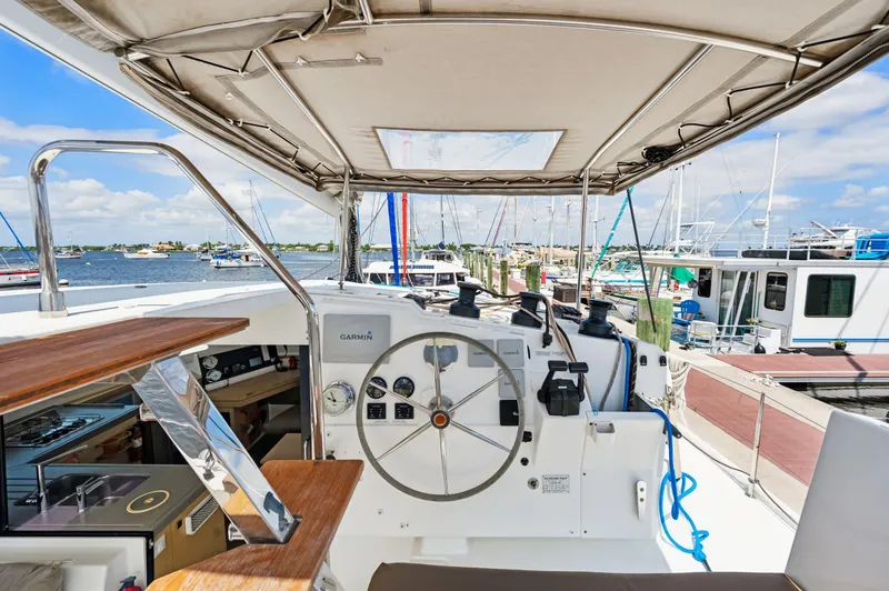 Slide: The Image of Helm of 2018 Fountaine Pajot Lucia 40 catamaran docked at marina. - 54