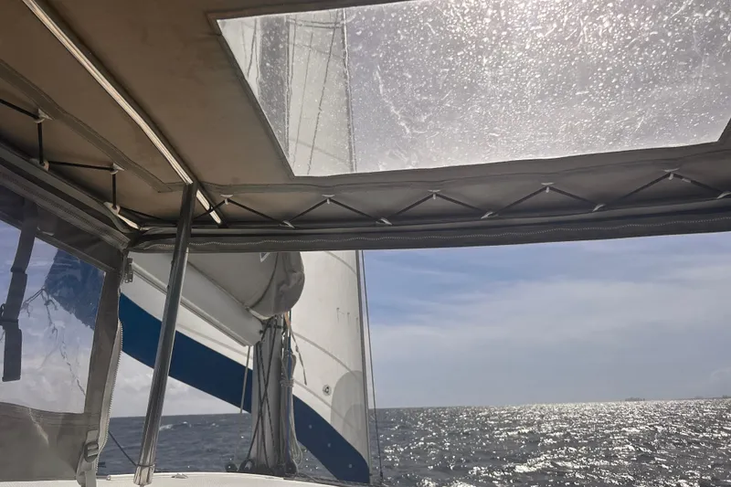 Slide: The Image of Sailing view from 2018 Fountaine Pajot Lucia 40 catamaran, ocean and sky in background. - 67