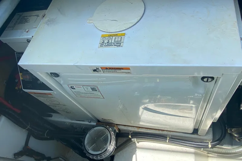 Slide: The Image of Engine compartment of 2018 Fountaine Pajot Lucia 40 catamaran, featuring Onan generator. - 80