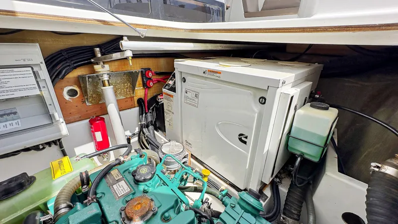 Slide: The Image of Engine room of 2018 Fountaine Pajot Lucia 40 catamaran with generator and mechanical components. - 81