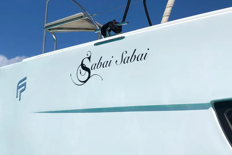 Slide: The Image of Fountaine Pajot Lucia 40 catamaran, 2018 model, with "Sabai Sabai" name on the side. - 86