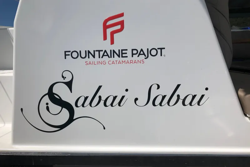 Slide: The Image of 2018 Fountaine Pajot Lucia 40 catamaran with "Sabai Sabai" name on hull. - 87