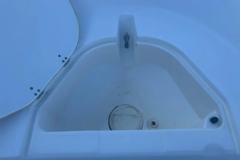 Slide: The Image of 2010 Boston Whaler 130 Super Sport boat, close-up view with logo. - 12