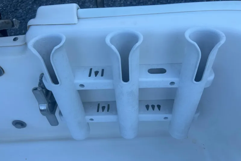 Slide: The Image of 2010 Boston Whaler 130 Super Sport on trailer, parked on gravel. - 15