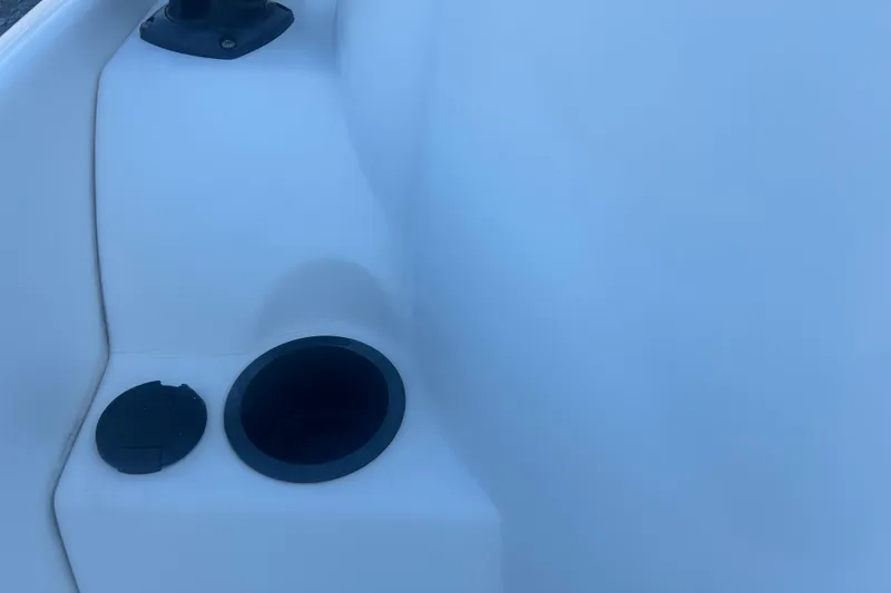 Slide: The Image of 2010 Boston Whaler 130 Super Sport boat on trailer with Mercury engine. - 16