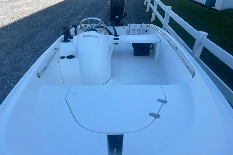 Slide: The Image of 2010 Boston Whaler 130 Super Sport interior with storage and equipment. - 6