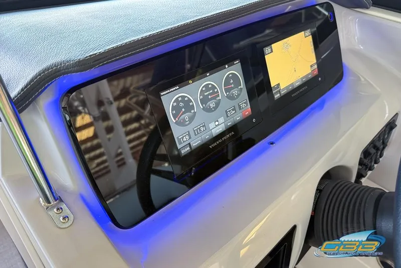 Slide: The Image of 2022 Regal LS2 Surf dashboard with digital display and navigation system. - 14