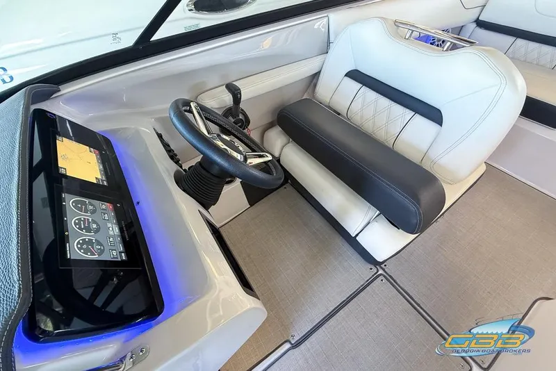 Slide: The Image of 2022 Regal LS2 Surf boat interior with modern dashboard and comfortable seating. - 18