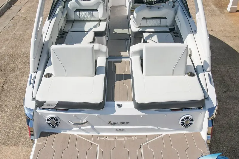 Slide: The Image of 2022 Regal LS2 Surf boat interior with white seating and modern design. - 27